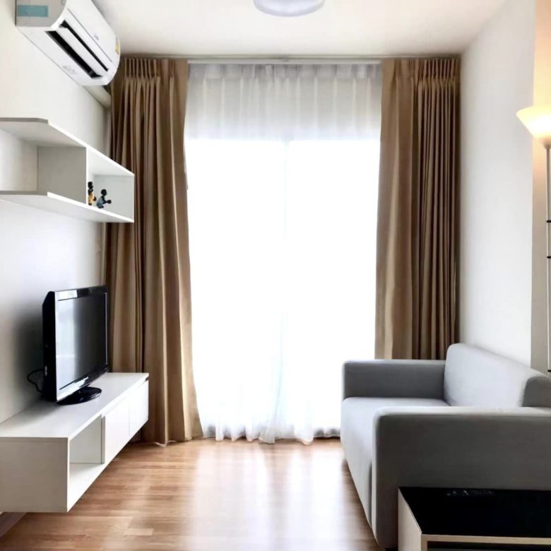 Interior view of a modern 1-bedroom condo at The Trust Condo Pattaya, fully furnished with city views.