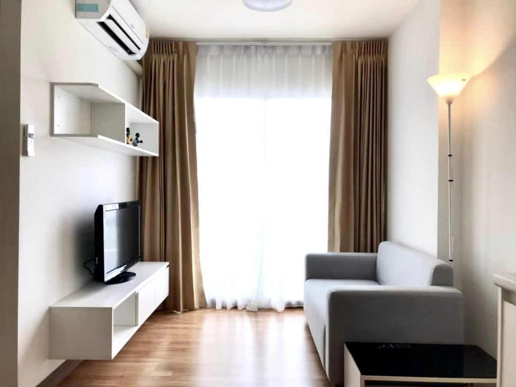 Interior view of a modern 1-bedroom condo at The Trust Condo Pattaya, fully furnished with city views.