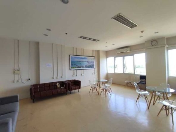 Interior view of a modern studio condo at Unicca Pattaya with cityscape views.