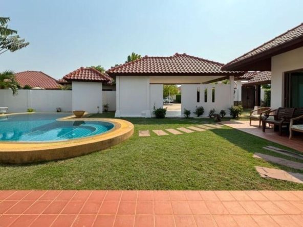Luxurious pool villa at Baan Balina 3 in Pattaya with lush garden and private pool.